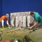 The team works on a set for The Fantastic Flying Books of Morris Lessmore. Image from http://morrislessmore.com/